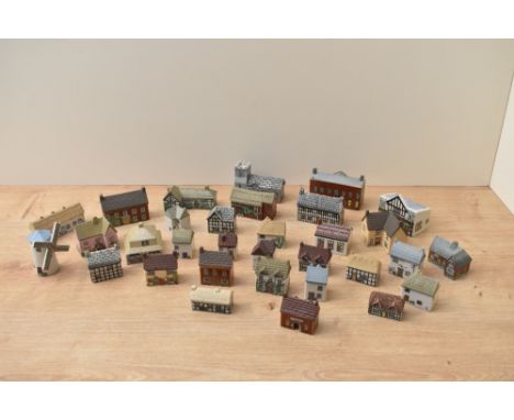A Wade English porcelain 'Whimsey-On-Way' porcelain English village comprising complete sets one through four and village map