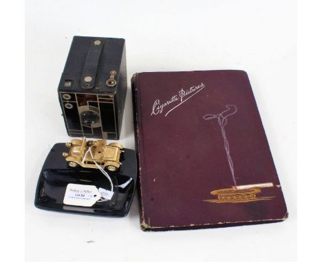 Eastman Kodak Beau Brownie camera, Lesney pin dish with car decoration, cigarette card album containing some cigarette cards 
