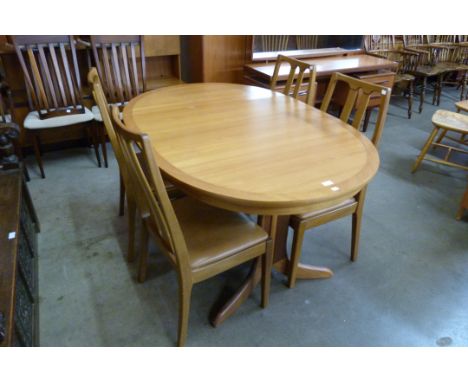 A Nathan teak extending table and four chairs 