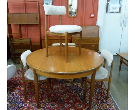 A G-Plan Fresco teak circular extending dining table and four chairs 