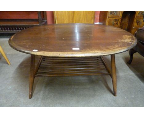 An Ercol Golden Dawn elm and beech oval Windsor coffee table 