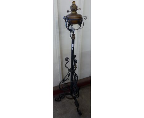 A Victorian Aesthetic Movement wrought iron and copper floor standing lamp 