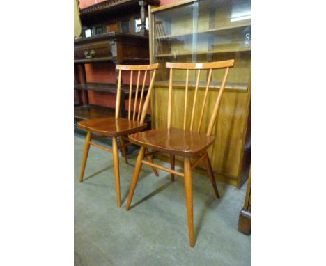 A pair of Ercol elm and beech 608 model chairs 