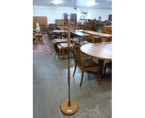 A teak standard lamp 