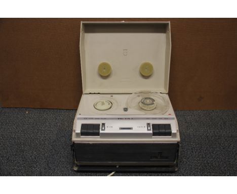 A 1970's Grundig TK18L portable reel to reel tape recorder.