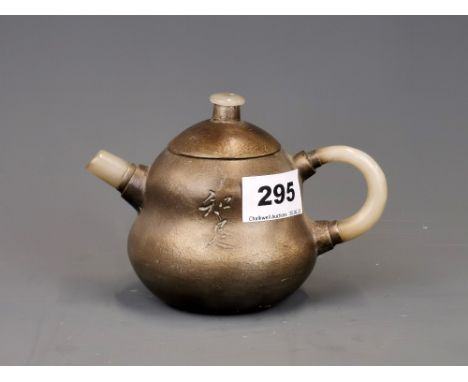 A Chinese pewter overlaid terracotta tea pot with mutton fat jade spout and handles. H. 10cm spout to handle L. 14cm