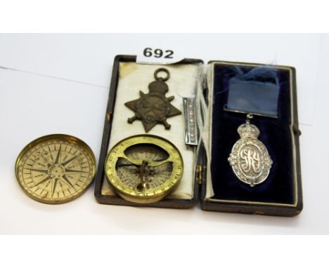 A cased silver medal for public service in India together with a WWI medal for Captain R.J.OWEN, I.M.D and a brass cased comp