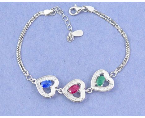 A 925 silver heart shaped bracelet set with oval cut emerald, sapphire and ruby and white stones, L. 17cm.