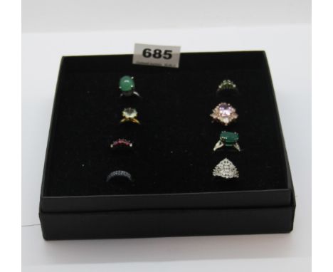 A box of eight silver stone set rings, including jade, diopside, etc.