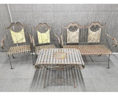 A vintage four piece continental folding wrought iron garden set, bench L. 110cm table H. 56cm.