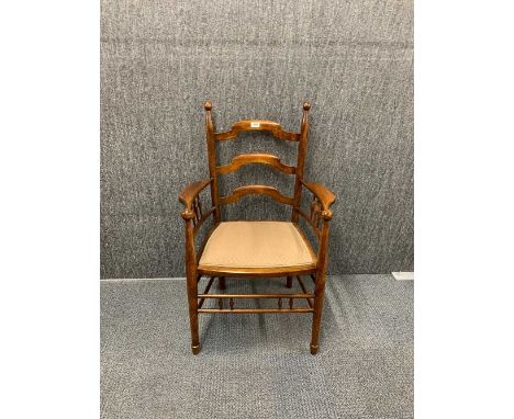 A lovely Arts and Crafts ladder back armchair.