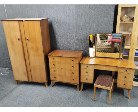 A 1960's light mahogany two door wardrobe, W. 95cm. together with a matching dressing table and stool with a four drawer ches