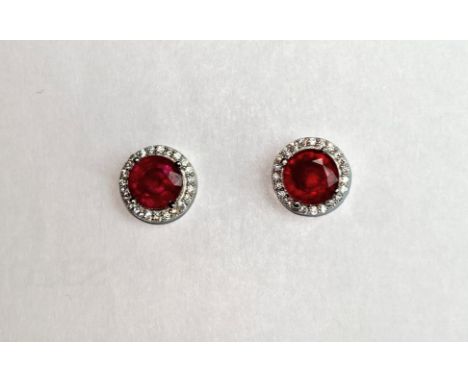 A pair of 925 silver ruby and white stone set cluster earrings, Dia. 1cm.