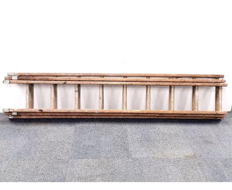 A three section vintage wooden ladder, unextended L. 211cm.