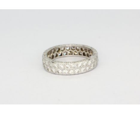 A white metal (tested high carat gold) full eternity ring set with two rows of brilliant cut diamonds, approx. 1.5ct overall,