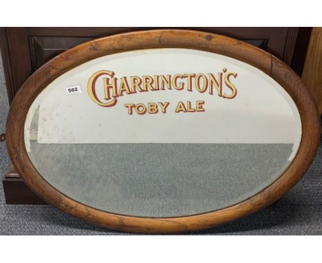 A 1930's oak framed Charrington's advertising pub mirror, W. 86cm.
