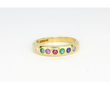 A hallmarked 18ct yellow gold "DEAREST" ring set with diamond, emerald, amethyst, ruby, sapphire and topaz, (M).