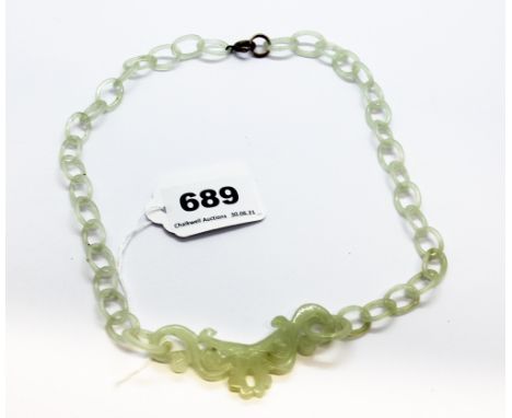 A very fine Chinese carved jade necklace and integral chain all formed from a single piece of jade, pendant W. 8cm, overall L