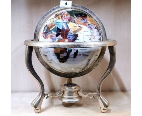 A mother of pearl and semi precious stone inlayed globe, H. 37cm.