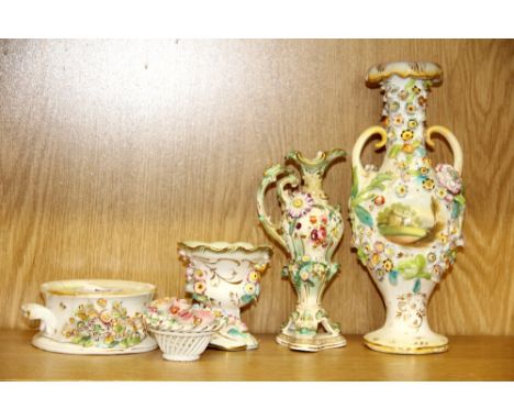 A group of four mid 19th century floral encrusted Coalbrookdale polychrome porcelain inkwell, urn and two vases (one with bas