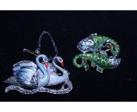 Two white metal and enamel brooches 