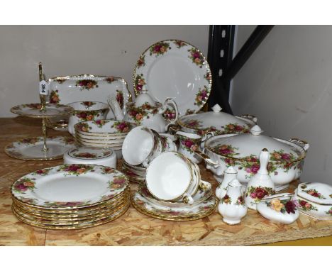 A QUANTITY OF ROYAL ALBERT DINNERWARE, comprising two covered tureens, six dinner plates, six side plates, six dishes, two sa