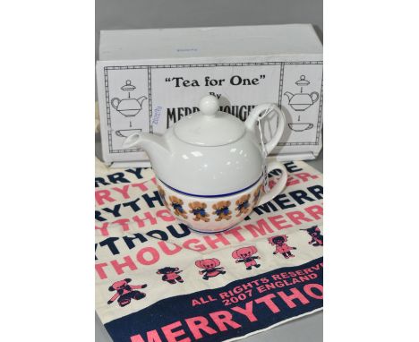 A BOXED ARTHUR WOOD 'TEA FOR ONE' TEAPOT,  by Merrythought, together with a small linen 'Merrythought' printed in pink and bl