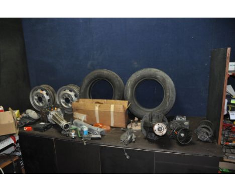 A COLLECTION OF VINTAGE CAR PARTS including a Differential embossed 196073, a headlight assembly, glass lens marked 01-1103 l