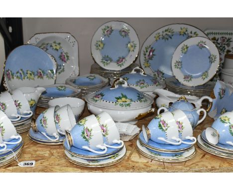 AN EIGHTY THREE PIECE HANDPAINTED DINNER SERVICE, hand painted with flowers on Shelley blanks, most pieces signed to base by 