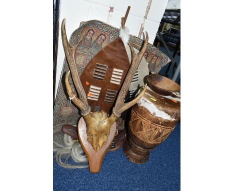 A SET OF MOUNTED THREE POINT ANTLERS, TWO SMALL AFRICAN SHIELDS, OTHER 20TH CENTURY TOURIST SOUVENIRS AND A PAINTED LEATHER W