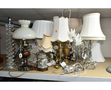 A QUANTITY OF TABLE LAMPS, comprising three brass lamp bases, six clear glass and acrylic lamp bases, eleven cream shades, an