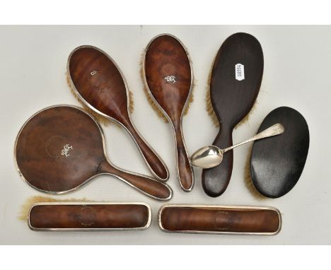 A SILVER AND IMITATION TORTOISESHELL DRESSING TABLE SET ETC., including four hair brushes and a hand mirror, all with silver 