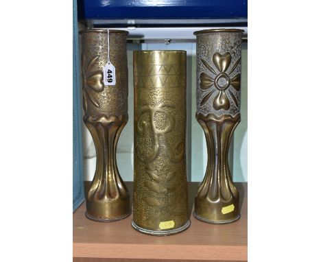 A PAIR OF FLUTED TRENCH ART VASES, decorated with a floral design, together with a single trench art vase decorated with the 