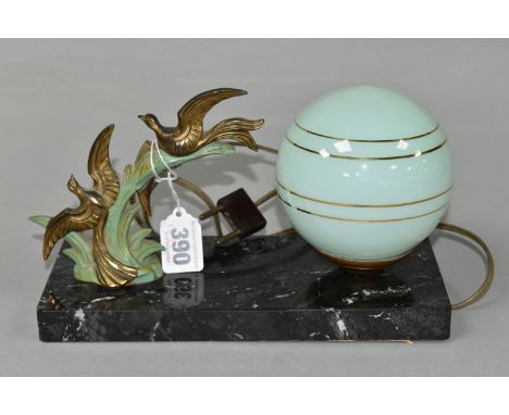 AN ART DECO DESK LAMP DEPICTING A PAIR OF BRONZED BIRDS IN FLIGHT MOUNTED TO A MARBLE PLINTH, with green glass shade, approxi