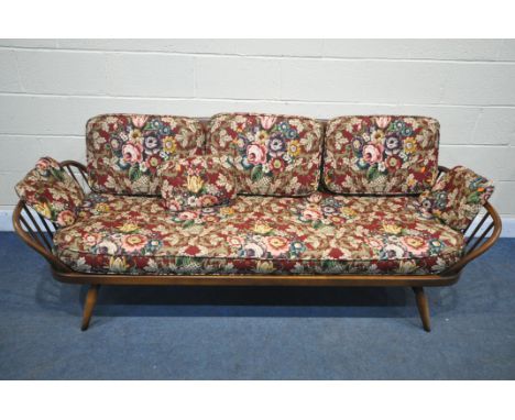 AN ERCOL MODEL 355 STUDIO DAY BED, with an elm surfboard back, and a beech frame, length 206cm x depth 80cm x height 77cm (co