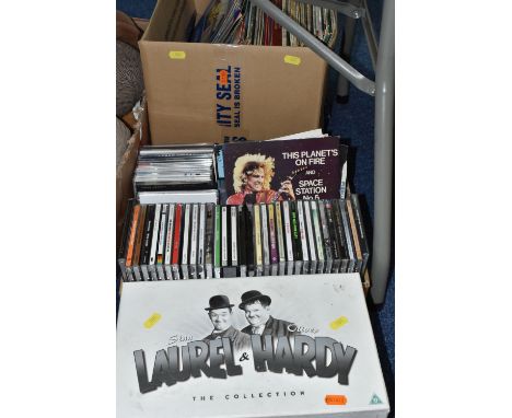 THREE BOXES OF CDS, LPS AND DVDS, comprising a twenty one piece boxed set of Laurel &amp; Hardy DVDs, approximately forty CDs