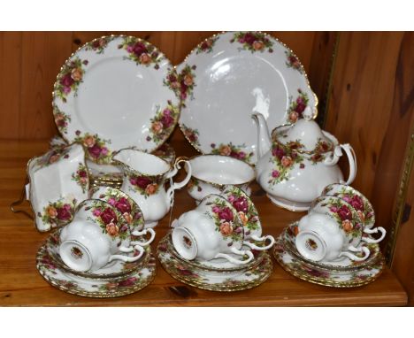 A TWENTY NINE PIECE ROYAL ALBERT OLD COUNTRY ROSES TEA SET, comprising a teapot, a cake plate, a cream jug (chipped and repai