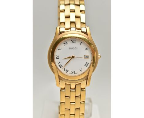 A LADYS 'GUCCI' QUARTZ WRISTWATCH, round white dial signed 'Gucci', Roman numerals, date window at the three o'clock position