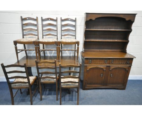 AN OAK REFECTORY TRESTLE TABLE, width 138cm x depth 68cm x height 76cm, six ladder back chairs, together with dark oak dresse