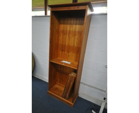 A TALL MODERN PINE OPEN BOOKCASE, with one centrally fixed shelf and six adjustable shelves. (Condition report: - general age