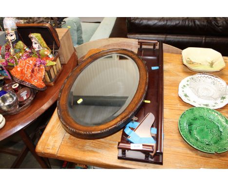 An oak framed, bevel edged wall mirror together with a reproduction shelf AF