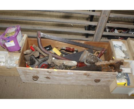 A wooden drawer containing a quantity of vintage tools to include saws, drill braces, shoe lasts etc.
