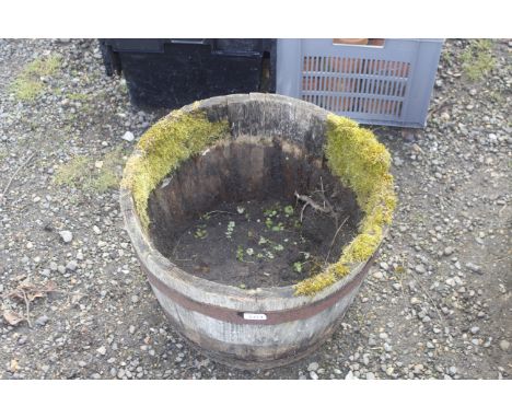 A planter in the form of half a barrel