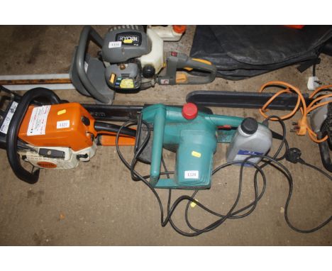 A Bosch AKE40 corded electric chainsaw, with a small quantity of chainsaw oil
