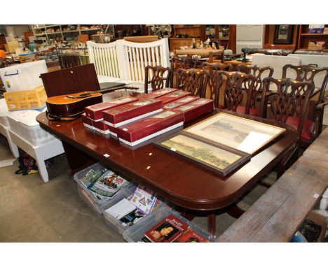 An Arthur Brett and Sons Regency style mahogany reproduction extending dining table with two extra leaves (lacking the suppor
