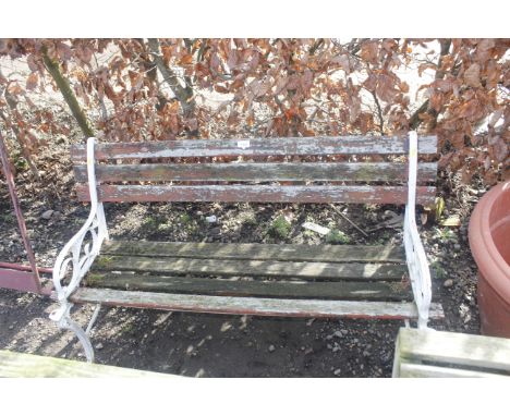 A two seater garden bench with cast iron ends 