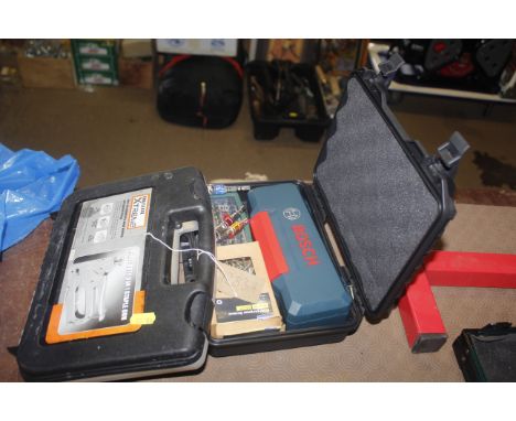 A Bosch cordless electric screwdriver with bit set and a heavy duty stapler