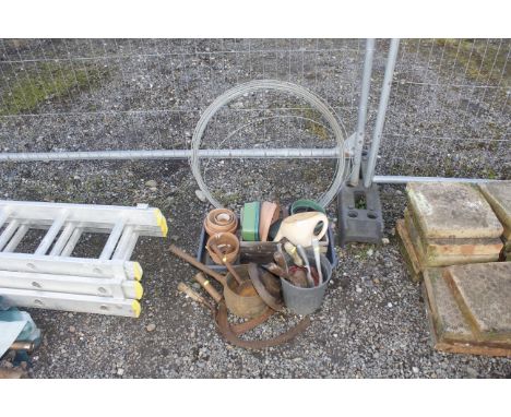 A small quantity of garden tools together with plant pots and a spool of wire