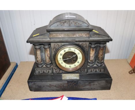 A late Victorian black slate mantel clock with presentation plaque 