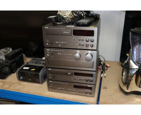 A Yamaha stack consisting of a Stereo cassette deck, KX-10; a Natural Sound Stereo amplifier AX-9; a Natural Sound compact di
